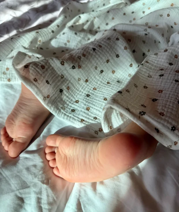 Close-up of floral cotton muslin fabric texture – OEKO-TEX certified, soft 130g muslin weave, safe for newborn skin