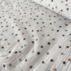 Folded floral muslin swaddle blanket flat lay – perfect baby shower gift, soft cotton newborn blanket, handmade in Lithuania